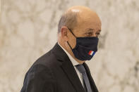 French Foreign Minister Jean-Yves Le Drian, wearing a mask to help prevent the spread of the coronavirus, arrives to meet Lebanese president Michel Aoun at the Presidential Palace in Baabda, east of Beirut, Lebanon, Thursday, July 23, 2020. (AP Photo/Hassan Ammar)