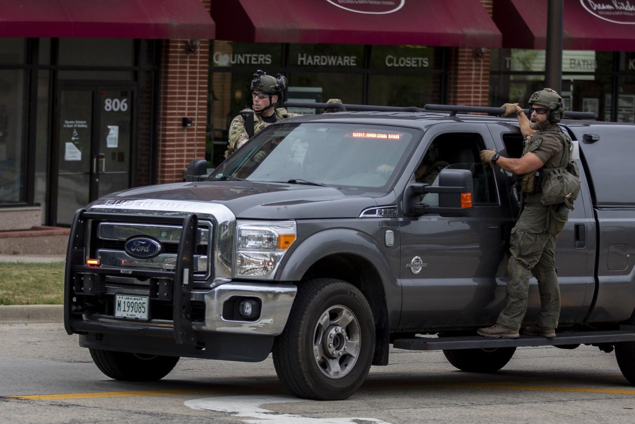 First responders work the scene of a shooting at a Fourth of July parade on July 4, 2022 in Highland Park, Illinois. 