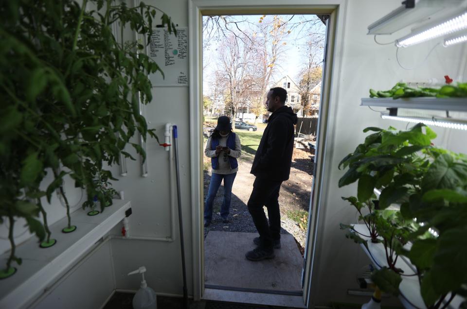 Allison DeHonney, president and CEO of Buffalo Go Green/Urban Fruits and Veggies, and farm manager Rickey Fleming use an NFL-donated grow shed to grow more produce hydroponically.