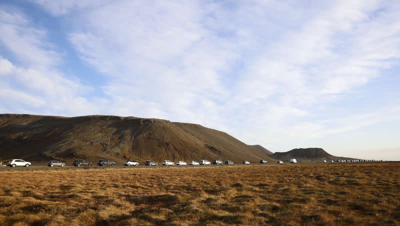 A line of cars queued on a road heading to the town of Grindavik, Iceland, on Monday Nov. 13, 2023. Residents of Grindavik, a town in southwestern Iceland, have been briefly allowed to return to their homes on Monday after being told to evacuate on Saturday after increasing concern about a potential volcanic eruption caused civil defense authorities to declare a state of emergency in the region.