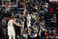 Oct 29, 2017; Indianapolis, IN, USA; Indiana Pacers guard Victor Oladipo (4) scores a basket and is fouled by San Antonio Spurs center Pau Gasol (16) at Bankers Life Fieldhouse. Brian Spurlock-USA TODAY Sports