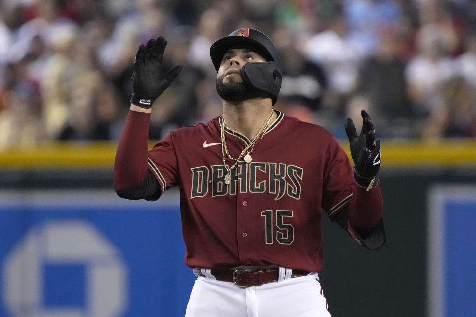 Arizona Diamondbacks' Emmanuel Rivera reacts after reaching secondbase on an error by the St. Louis Cardinals third baseman Brendan Donovan in the second inning during a baseball game, Sunday, Aug. 21, 2022, in Phoenix. (AP Photo/Rick Scuteri)