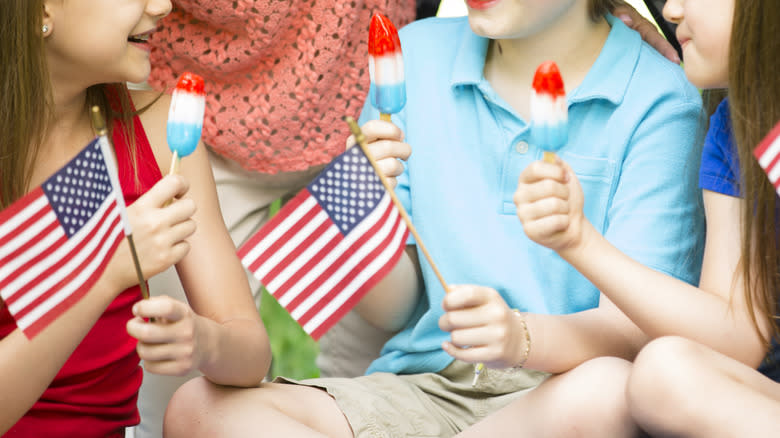 kids holding Bomb Pops and American flags