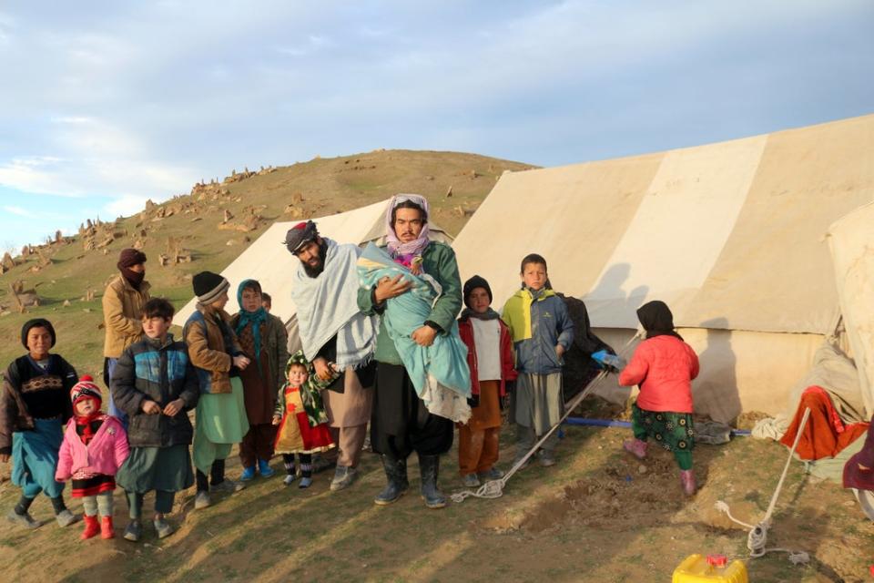 Afghan villagers wait to receive food after their home was damaged by last week’s earthquake in the remote western province of Badghis, (Abdul Raziq Saddiqi/AP) (AP)