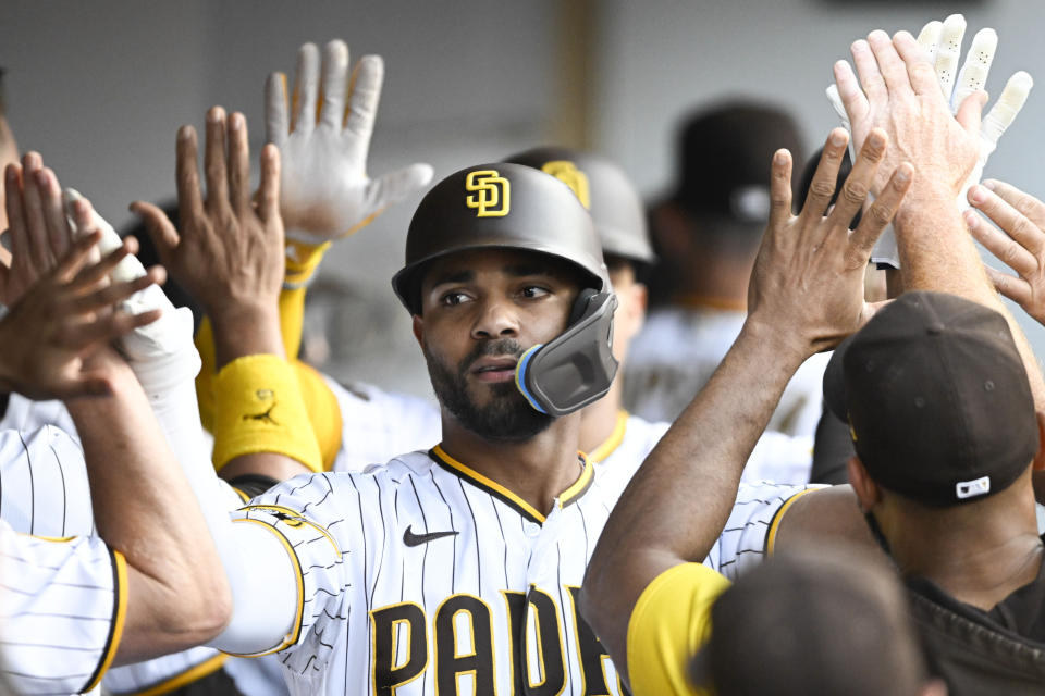 San Diego Padres' Xander Bogaerts is congratulated after hitting a three-run home run during the first inning of a baseball game against the Los Angeles Angels, Monday, July 3, 2023, in San Diego. (AP Photo/Denis Poroy),