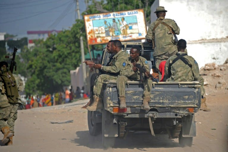 Somali soldiers patrol in a pickup truck in Mogadishu on June 21, 2015