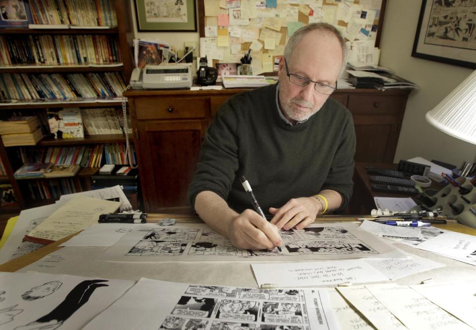 In this April 10, 2012 photo, cartoonist Tom Batiuk, creator of the comic strip Funky Winkerbean, inks a strip at the drawing table of his Medina, Ohio home studio. During its 40-year run on the funny pages, the characters and Batiuk have evolved and so have the story lines, from high school hijinks and awkward teen dating moments to dealing with adult issues like alcoholism, suicide and cancer. His latest hot topic story line during May: two boys who want to go to the high school prom together. (AP Photo/Amy Sancetta)