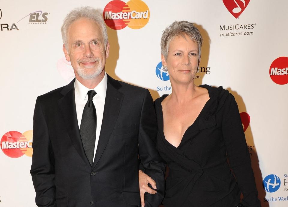 Jamie and Christopher smile while attending an event