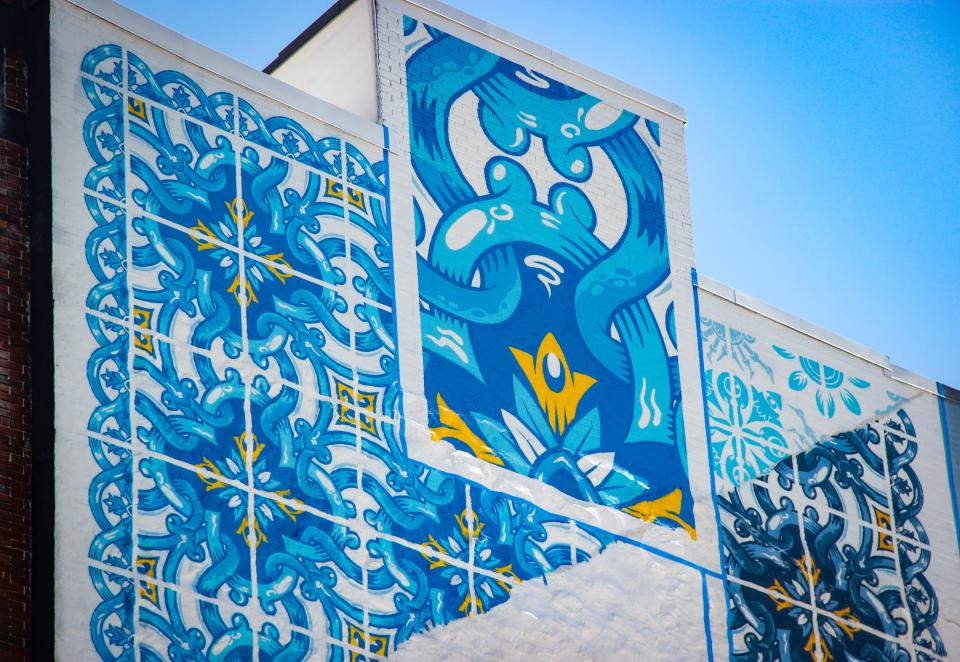 Where the Herald News logo once lived on the side of this building on Pocasset Street in Fall River, Portuguese artist Diogo Machado, aka Add Fuel, is creating a mural of Portuguese tiles, on July 22, 2022.