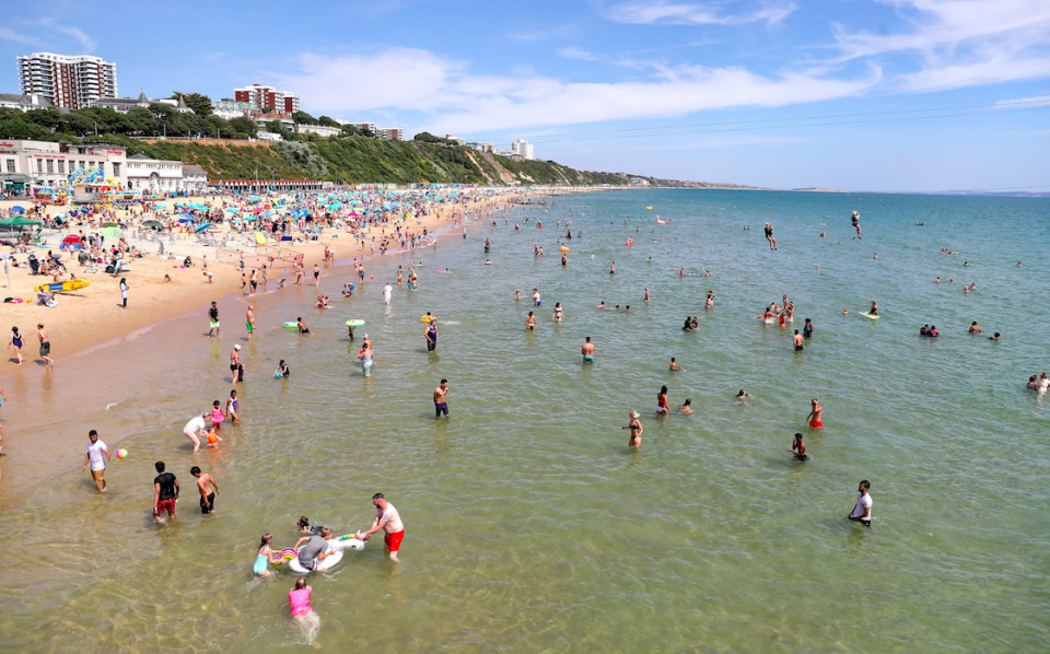 <em>Brits bask in the sunshine at Bournemouth beach (PA)</em>