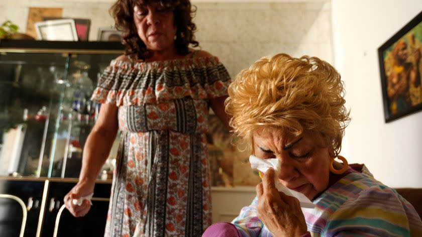 LOS ANGELES, CA - MAY 8, 2017 - Ossie Hill, 86, right, cries over the possibility of foreclosure of her home as her daughter Cassina Edwards, 59. looks on in Los Angeles on May 8, 2017. Hill, 86, who suffers from dementia, received a PACE loan and says the contractor misrepresented how this would work and she now faces foreclosure. PACE loans is a type of home improvement loans that are pitched by contractors. Consumer groups have raised concerns about these, saying contractors misrepresent how they work and people are now getting into trouble with the loans. (Genaro Molina/Los Angeles Times)