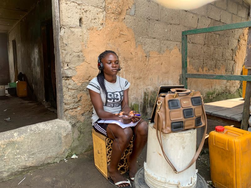 Esther Ikechukwu, a beneficiary of Slum2School project attends a virtual class from her home in Makoko, Lagos