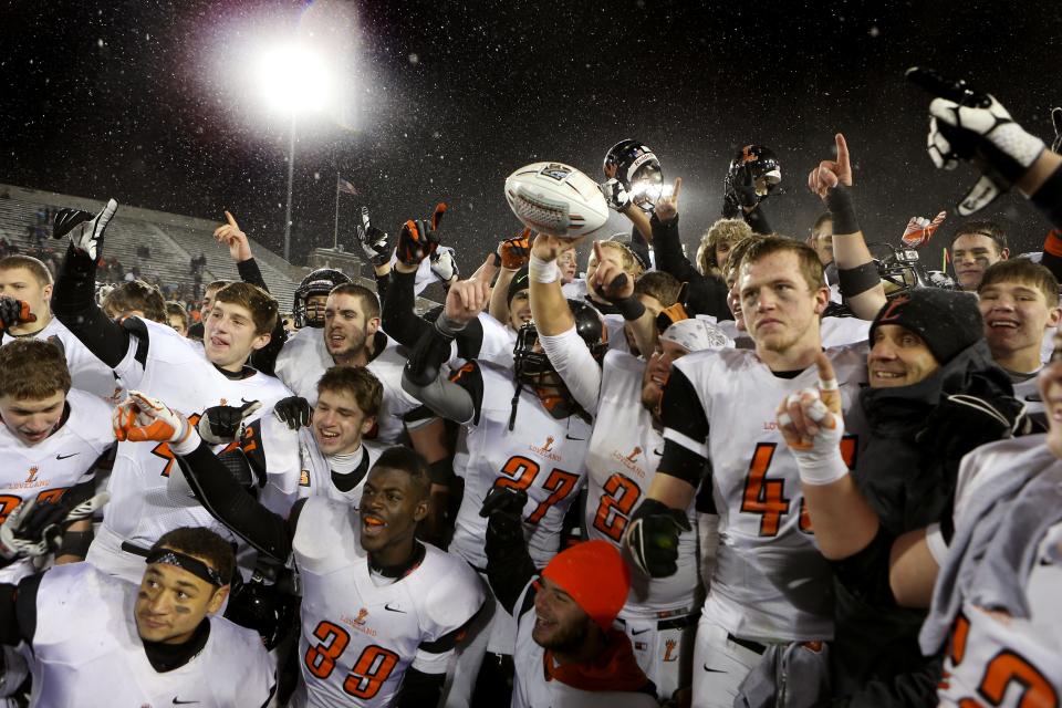 Loveland team gestures number one as they celebrates after Loveland beat Cleveland Glenville in the 4th quarter. Loveland High School battles Cleveland Glenville High School in Division II state Championship football game at Fawcett Stadium Friday December 7, 2013 in Canton, Ohio. Loveland won 41 to 23 over Cleveland Glenville.