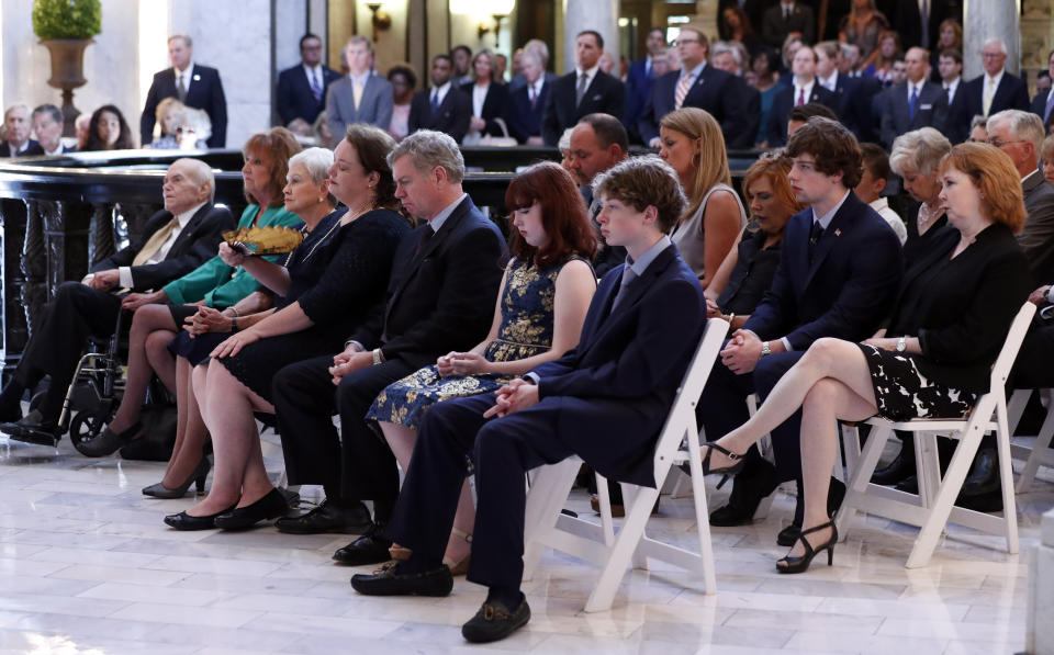 Family members of the former Republican senator Thad Cochran, sit in attendance at his funeral service in the Mississippi State Capitol rotunda in Jackson, Miss., Monday, June 3, 2019. Cochran was 81 when he died Thursday in a veterans' nursing home in Oxford, Miss. (AP Photo/Rogelio V. Solis)