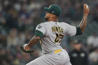 Oakland Athletics starting pitcher Frankie Montas throws against the Seattle Mariners during the first inning of a baseball game, Sunday, July 3, 2022, in Seattle. (AP Photo/Ted S. Warren)
