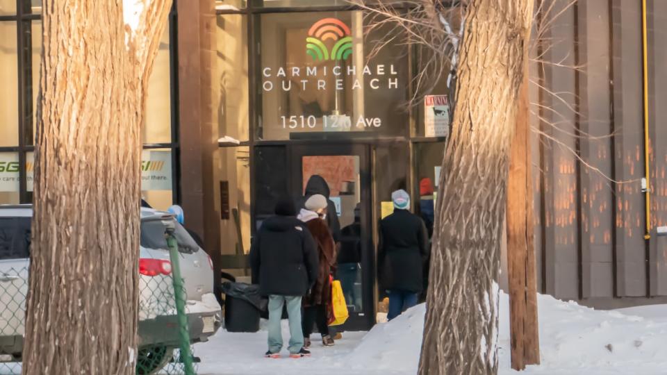 People lining up outside the non-profit Carmichael's Outreach in January 2022.
