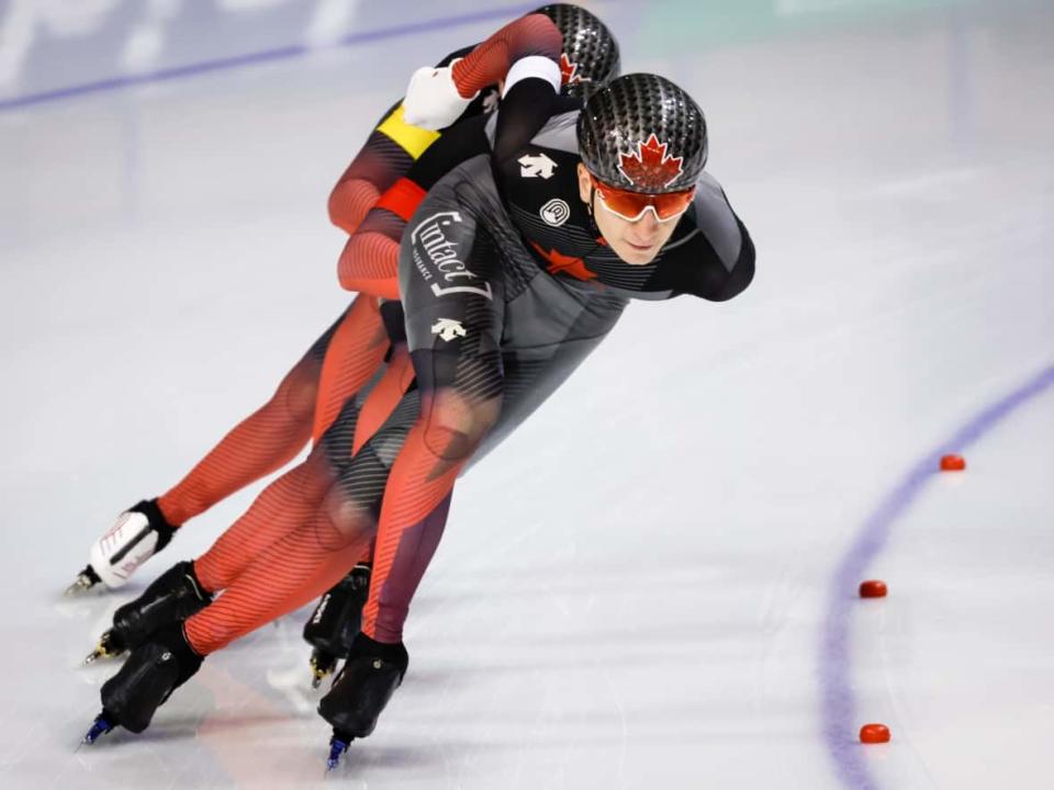 Canada's Antoine Gélinas-Beaulieu, front, Connor Howe, centre, and Hayden Mayeur compete during the men's team pursuit competition at the ISU World Cup speed skating stop in Calgary on Friday. (Jeff McIntosh/The Canadian Press - image credit)