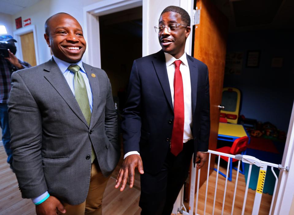 Johnson, left and Milwaukee County Executive David Crowley, right, tour the opening of Employ Milwaukee's satellite opening of Bellies to Babies May 23.