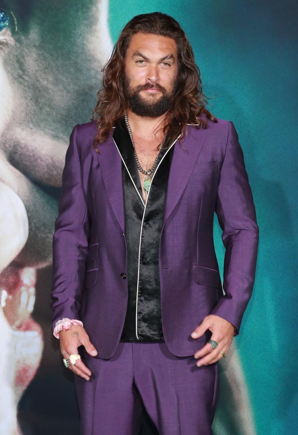 Momoa at the the premiere of the Joker wearing a scrunchie in September, 2019.