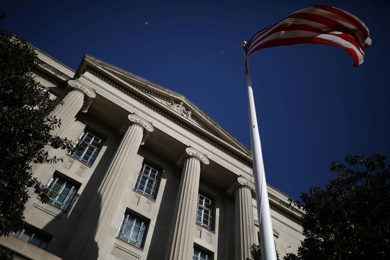FILE PHOTO: American flag waves outside the U.S. Department of Justice Building in Washington