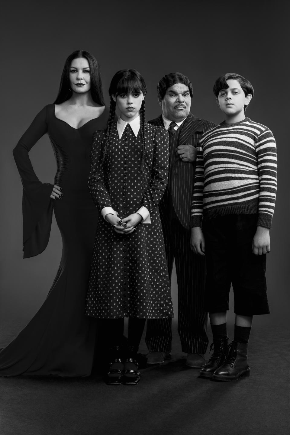 Wednesday. (L to R) Catherine Zeta-Jones as Morticia Adams, Jenna Ortega as Wednesday Addams, Luis Guzma?n as Gomez Addams, Issac Ordonez as Pugsley Addams in Wednesday. (Netflix)