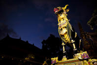 UBUD, BALI, INDONESIA - AUGUST 17: A black bull sarcophagus stands at Puri Ubud during the Hindu Royal cremation - also know as the Pengabenan - for the late Anak Agung Niang Rai, mother of Gianyar Regent, Tjokorda Oka Artha Ardana Sukawati, at Puri Ubud in Gianyar Bali on August 17, 2011 in Ubud, Bali, Indonesia. Niang Rai died in a Denpasar hospital in May; her actual cremation will take place on August 18 and will involve a nine level, 24m high 'bade' or body carring tower, made by upto 100 volunteers from 14 local villages. It will be carried to the cremation by 4500 Ubud residents. (Photo by Ulet Ifansasti/Getty Images)