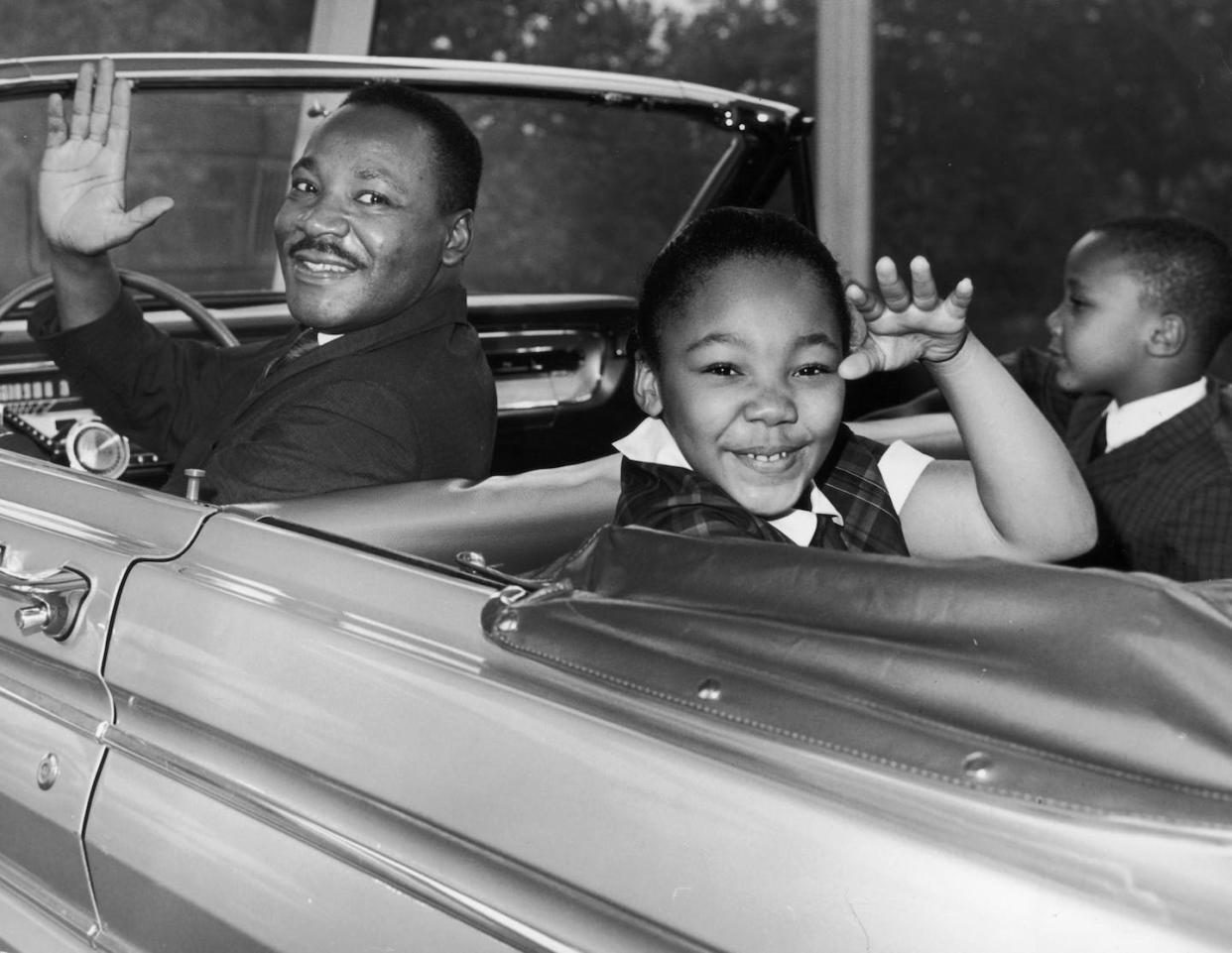 Martin Luther King Jr. waves with his children, Yolanda and Martin Luther III, from the 1964 World's Fair in New York City. <a href="https://www.gettyimages.com/detail/news-photo/american-civil-rights-leader-martin-luther-king-jr-waves-news-photo/3226480?adppopup=true" rel="nofollow noopener" target="_blank" data-ylk="slk:Photo by Hulton Archive/Getty Images;elm:context_link;itc:0;sec:content-canvas" class="link ">Photo by Hulton Archive/Getty Images</a>