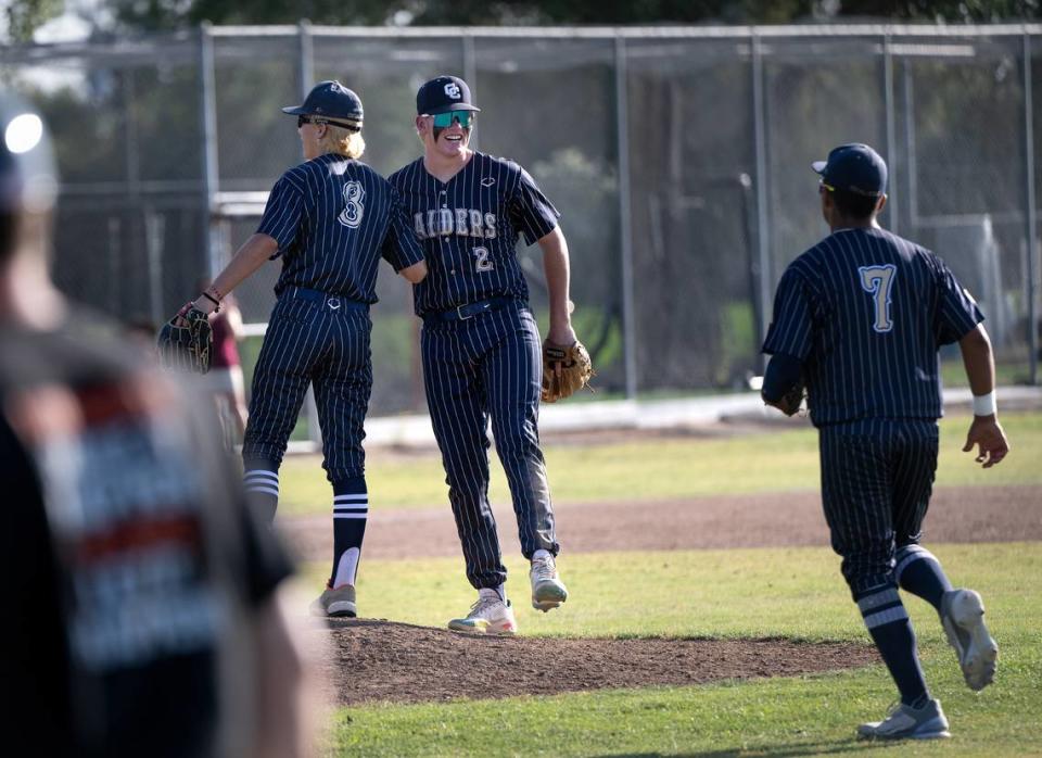 Central Catholic’s Joseph Salacup (8) closed the game at pitcher and teammate Seth Van Dyk (2) celebrate the the victory in the Northern California Regional Division III semifinal playoff game with Arcata at Central Catholic High School in Modesto, Calif., Thursday, June 1, 2023. Central won 7-4.