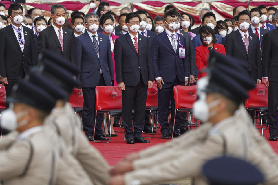 Chief Executive John Lee, center, attends a flag raising ceremony at the Golden Bauhinia Square to mark the 25th anniversary of the former British colony's return to Chinese rule, in Hong Kong, Friday, July 1, 2022. (AP Photo/Magnum Chan, Pool)