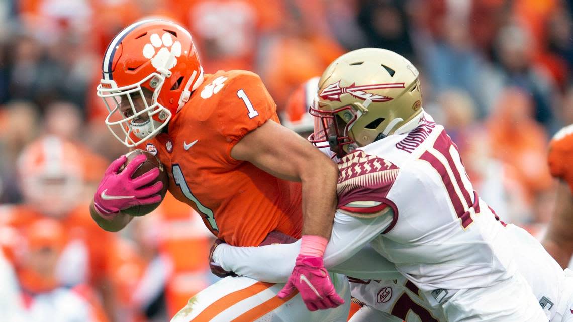 Clemson Tigers running back Will Shipley (1) breaks a tackle from Florida State defensive back Jammie Robinson (10) in the first half of an NCAA college football game, Saturday, Oct. 30, 2021, in Clemson, S.C. (AP Photo/Hakim Wright Sr.)
