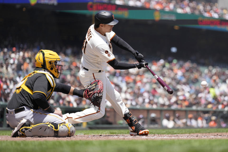 San Francisco Giants' Wilmer Flores hits a single to drive in a run against the Pittsburgh Pirates during the third inning of a baseball game in San Francisco, Wednesday, May 31, 2023. (AP Photo/Tony Avelar)