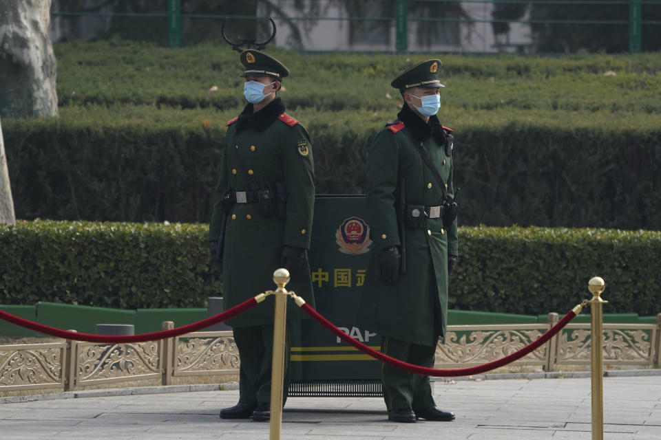 Chinese paramilitary policemen stand guard near the Great Hall of the People before delegates arrive to attend the opening session of the Chinese People's Political Consultative Conference (CPPCC) held in Beijing on Thursday, March 4, 2021. (AP Photo/Ng Han Guan)