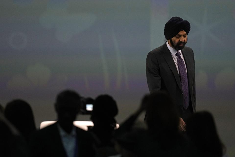 Ajay Banga, World Bank president, participates walks onstage at a session at the COP28 U.N. Climate Summit, Monday, Dec. 4, 2023, in Dubai, United Arab Emirates. (AP Photo/Rafiq Maqbool)