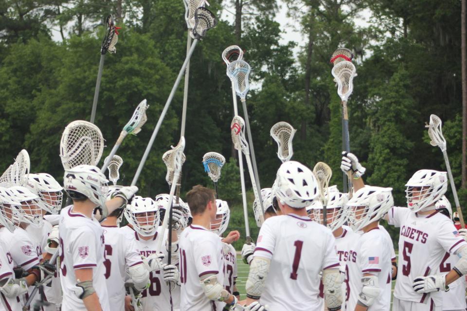 The Benedictine lacrosse team gathers before starting the second half of its playoff win over Holy Innocents on April 26, 2024.