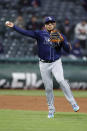 Tampa Bay Rays third baseman Isaac Paredes throws out Cleveland Guardians' Amed Rosario at first base during the eighth inning of a baseball game, Tuesday, Sept. 27, 2022, in Cleveland. (AP Photo/Ron Schwane)