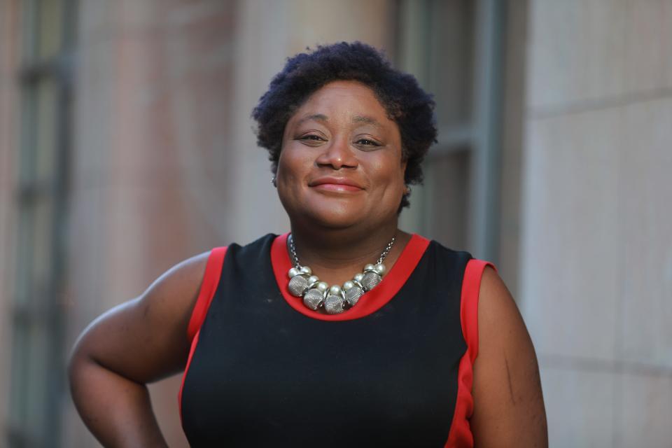 Columbus Dispatch editorial page editor and community engagement editor Amelia Robinson outside the 62 E. Broad St. newsroom on Monday, Nov. 8, 2021.