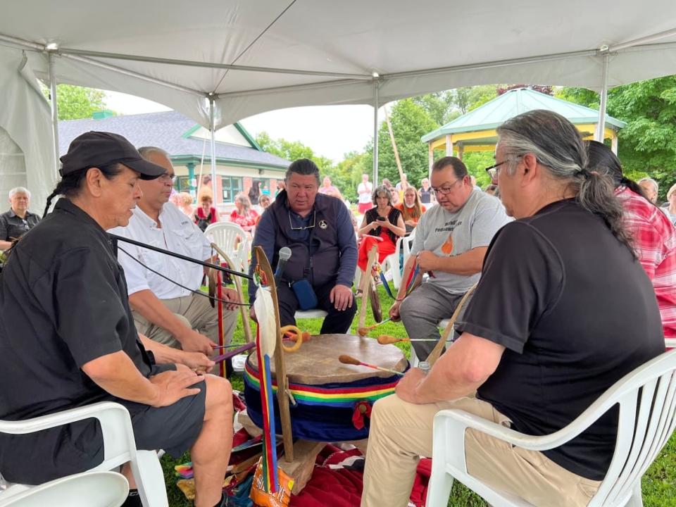 People take part in a drum circle at the New Edinburgh Fieldhouse in Ottawa on July 1, 2022, during the inaugural 'Chief Pinesi Day.' The day is intended to bring attention to the life and historic significance of the largely forgotten Grand Chief Constant Pinesi,  (Dan Taekema/CBC - image credit)