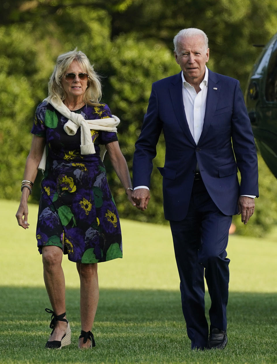 President Joe Biden and first lady Jill Biden walk on the South Lawn of the White House after stepping off Marine One, Sunday, June 27, 2021. - Credit: AP