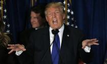 Republican U.S. presidential candidate Donald Trump reacts at his 2016 New Hampshire presidential primary night rally in Manchester, New Hampshire February 9, 2016. REUTERS/Jim Bourg