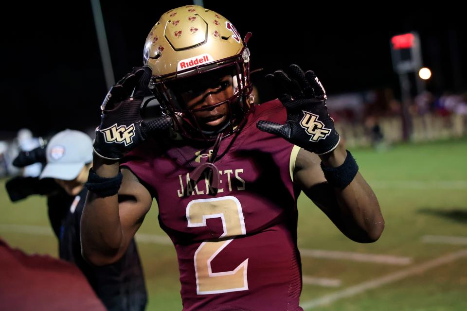 St. Augustine's Carl Jenkins Jr. (2) celebrates his touchdown score during the fourth quarter of an FHSAA Class 3S state semifinal high school football matchup Friday, Nov. 30, 2023 at St. Augustine High School in St. Augustine, Fla. The St. Augustine Yellow Jackets defeated the Dunbar Tigers 35-14 and advance to the state final in Tallahassee. [Corey Perrine/Florida Times-Union]