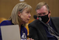 Birgit Fladager, left, speaks with David Harris, both of the Stanislaus County District Attorney's office, during a break in a hearing at the San Mateo County Superior Court in Redwood City, Calif., Thursday, Aug. 11, 2022. Scott Peterson is in court for a hearing to determine whether he gets a new trial in the murder of his pregnant wife because of juror misconduct. (AP Photo/Jeff Chiu, Pool)