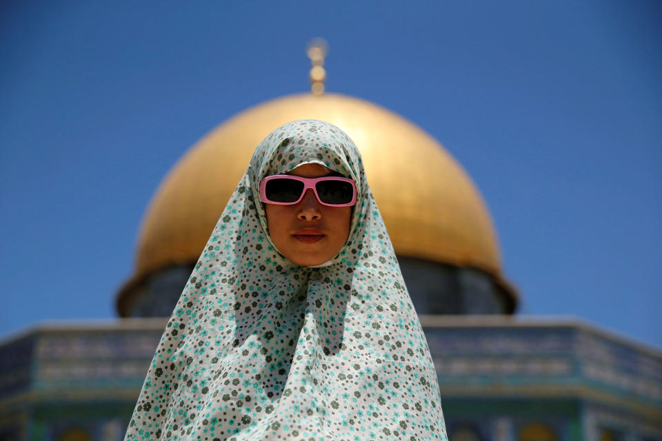 A Palestinian girl prays in Jerusalem