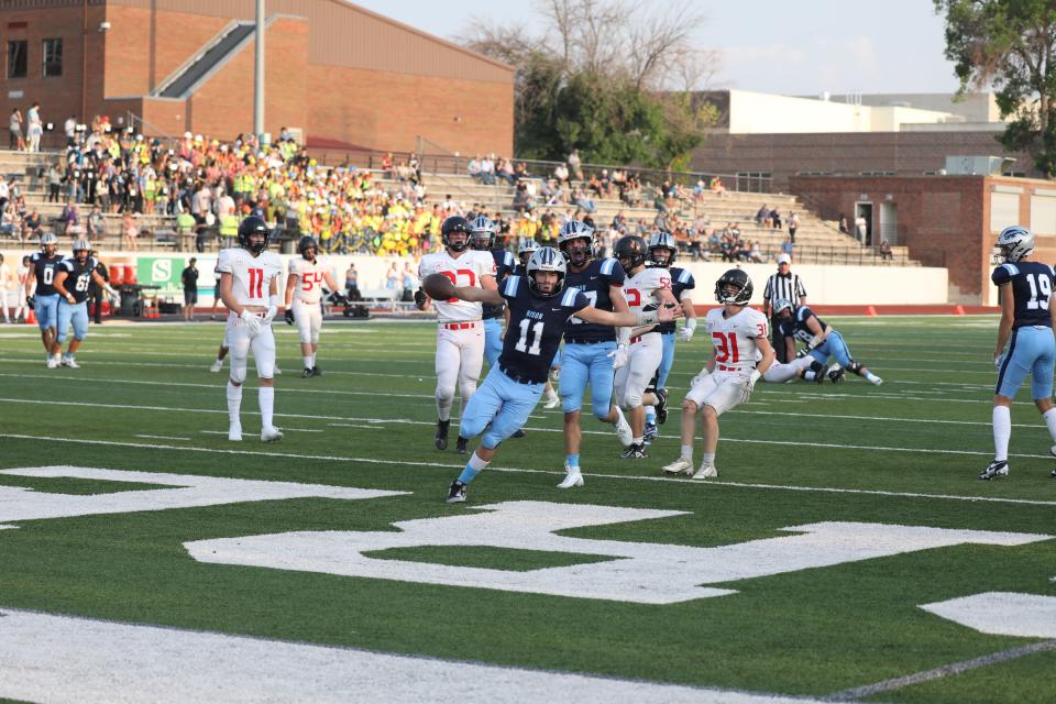 Great Falls High quarterback Riley Collette runs into the end zone for a touchdown against Missoula Hellgate earlier this season at Memorial Stadium.