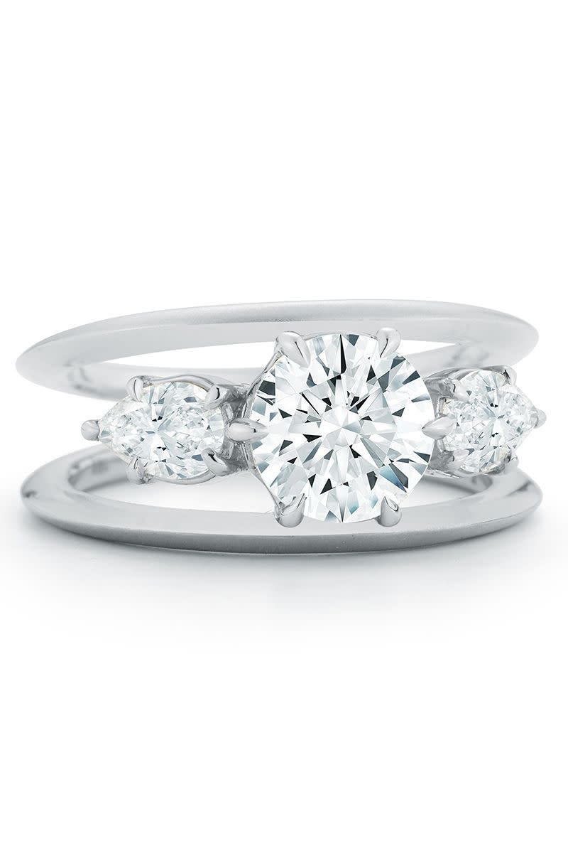 <p>This floating diamond look gives the illusion of loads of sparkle floating on air. Previously used in more fashion and cocktail ring settings, this trend is hitting the engagement ring scene—and the cool factor is off the charts. From tiny spirals to sleek lines, these rings are unconventional and mesmerizing all at once.</p><p><em><strong>Jade Trau</strong> "Sadie" Three Stone Ring with a brilliant round center surrounded by two petite diamond petals in 18K gold, $30,000, <a href="https://jadetrau.com/collections/rings/products/sadie-three-stone-ring-ready-to-ship" rel="nofollow noopener" target="_blank" data-ylk="slk:jadetrau.com;elm:context_link;itc:0;sec:content-canvas" class="link ">jadetrau.com</a>.</em></p><p><a class="link " href="https://jadetrau.com/collections/rings/products/sadie-three-stone-ring-ready-to-ship" rel="nofollow noopener" target="_blank" data-ylk="slk:SHOP;elm:context_link;itc:0;sec:content-canvas">SHOP</a><br><br></p>