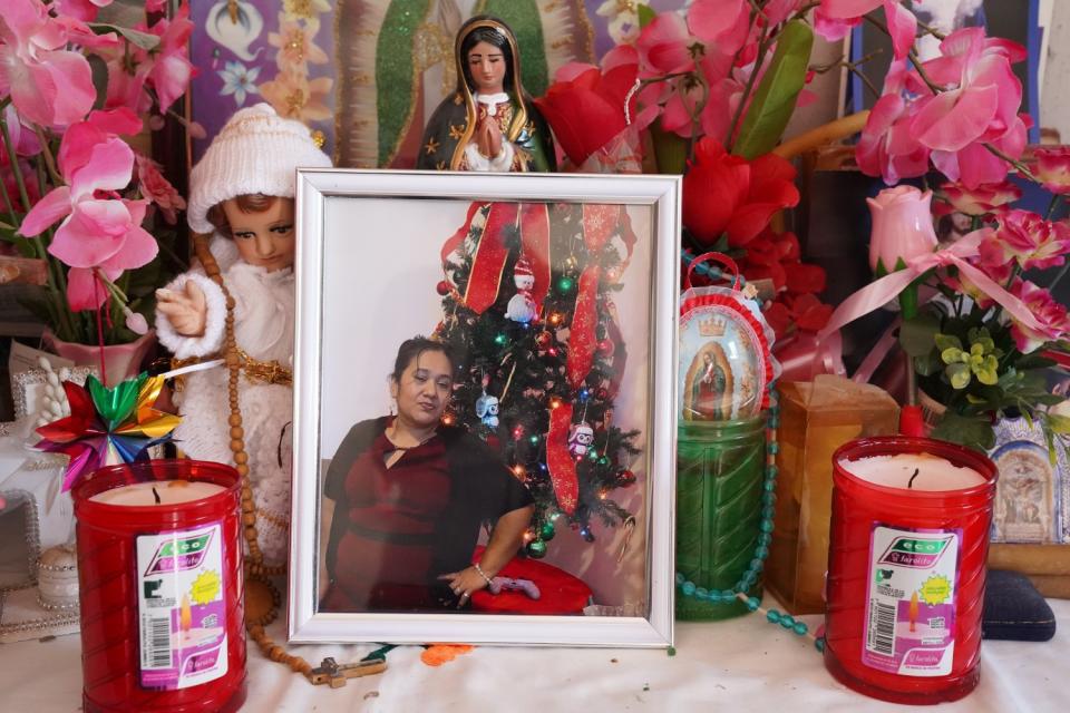 A photo of Maria Irasema Vaquero Lopez, who died of COVID-19 in the U.S., is set up on an altar at her Mexican home.