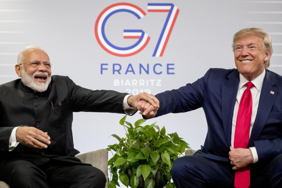 President Donald Trump and Indian Prime Minister Narendra Modi share a laugh together during a bilateral meeting at the G-7 summit in Biarritz, France, Monday, Aug. 26, 2019. (AP Photo/Andrew Harnik)