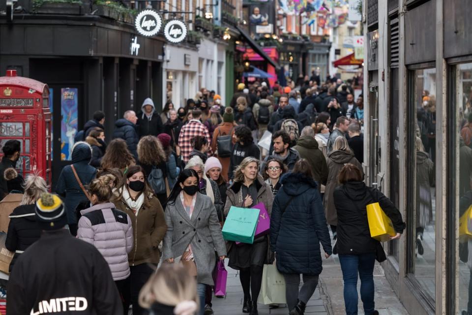 <div class="inline-image__caption"><p>Crowds of shoppers walk along Carnaby Street in London.</p></div> <div class="inline-image__credit">Wiktor Szymanowicz/Anadolu Agency via Getty</div>