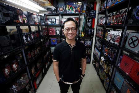 FILE PHOTO: Andy Kurniawan, who is the owner of an action figure store, poses for a photograph at his store in Jakarta, Indonesia, November 14, 2018. REUTERS/Willy Kurniawan