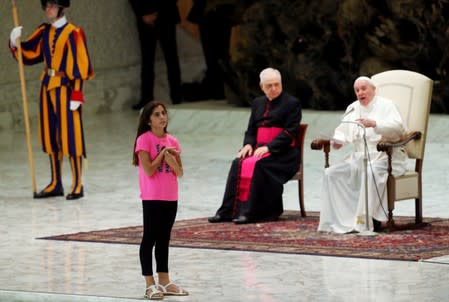 Braless model goes to meet Pope Francis and is led away by security.., World, News