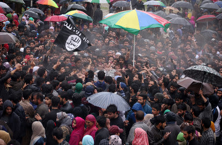People carry the body of Zakir Rashid Bhat also known as Zakir Musa, the leader of an al Qaeda affiliated militant group in Kashmir, during his funeral procession in Dadasara village in south Kashmir's Tral May 24, 2019. REUTERS/Danish Ismail